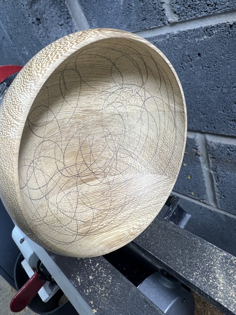 Pencil marks covering the inside of the bowl before hand sanding