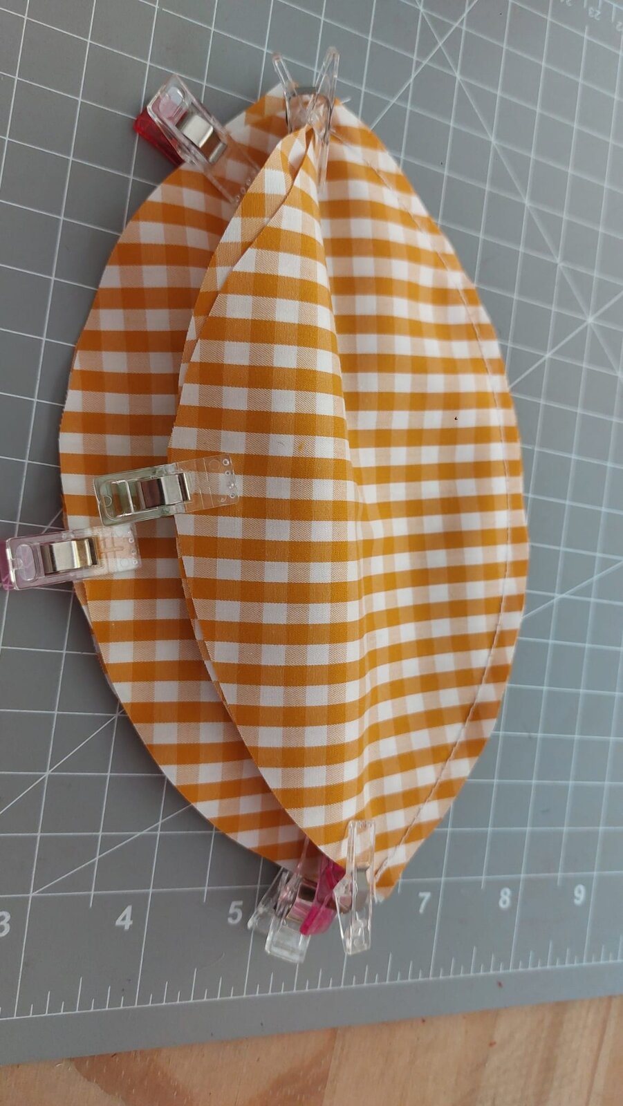 Gingham fabric pieces clipped together ready for sewing